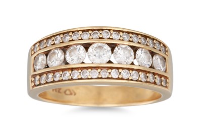 Lot 93 - A DIAMOND RING, the central row of brilliant...