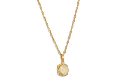 Lot 266 - A CITRINE PENDANT, mounted in 22ct gold, on a...
