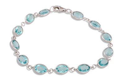 Lot 77 - A TOPAZ BRACELET, in white gold