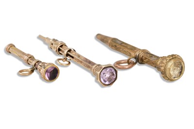 Lot 84 - THREE VICTORIAN GOLD PENCILS, gem set tops