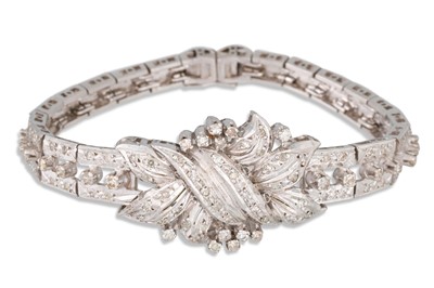 Lot 360 - A MID CENTURY DIAMOND SET BANGLE, set...