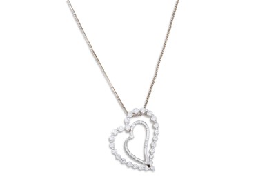 Lot 389 - A DIAMOND PENDANT, the heart shaped pendant...
