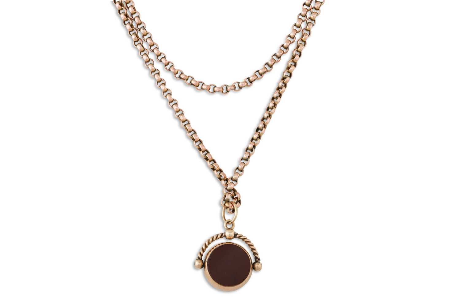 Lot 24 - AN ANTIQUE GOLD MUFF CHAIN, suspending a...
