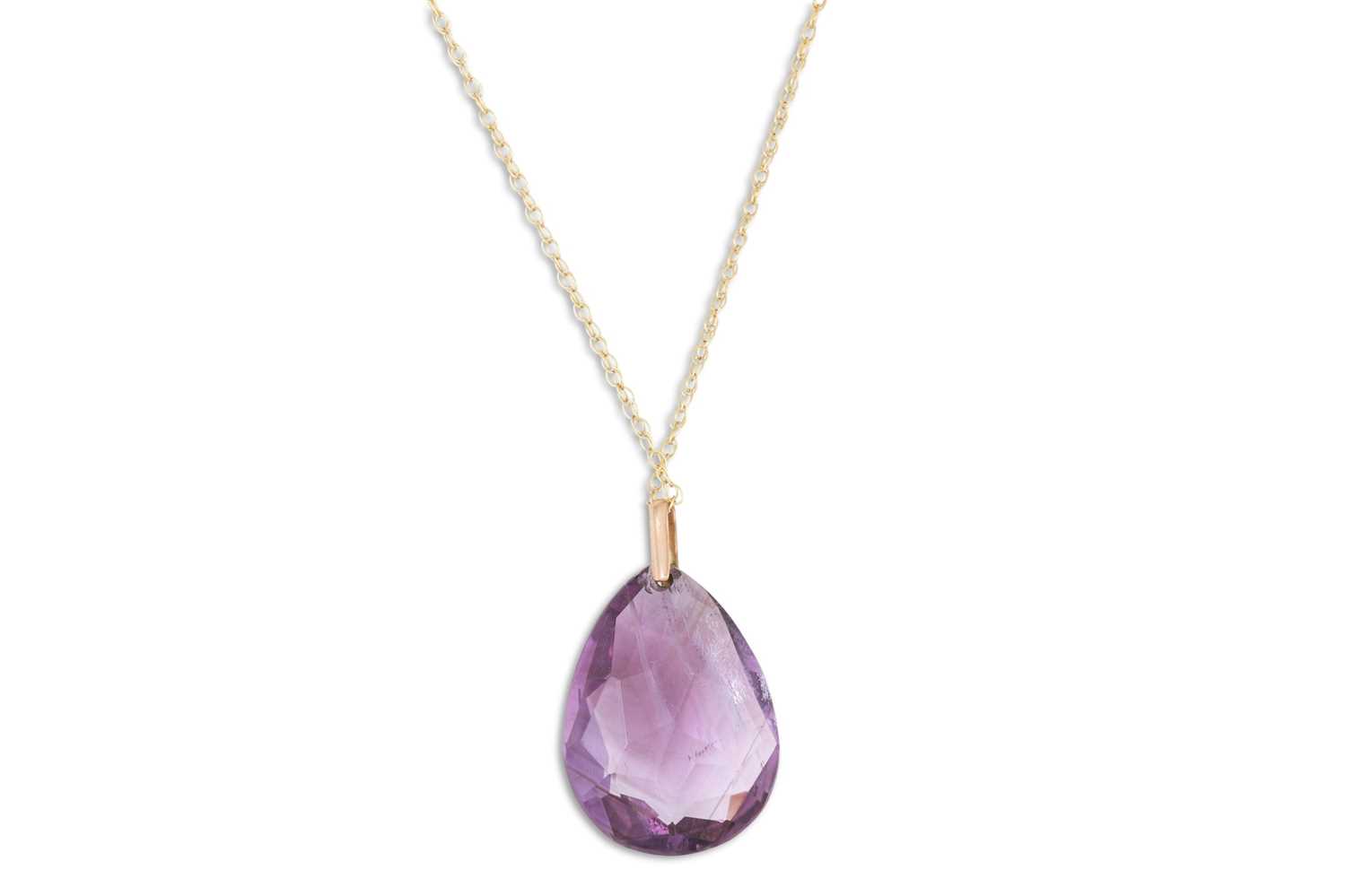 Lot 30 - AN AMETHYST PENDANT, the large briolette drop...