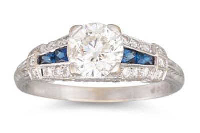 Lot 285 - A DIAMOND AND SAPPHIRE RING, the brilliant cut...