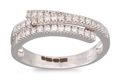 Lot 51 - A DIAMOND RING, the triple row diamonds...
