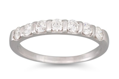 Lot 174 - A SEVEN STONE DIAMOND RING, the brilliant cut...