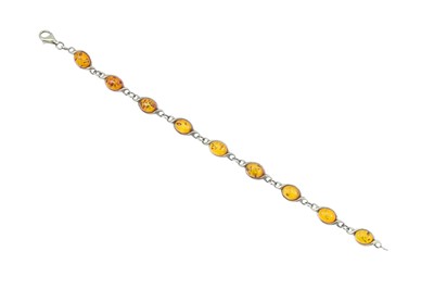 Lot 188 - A RESIN SET BRACELET, in yellow gold