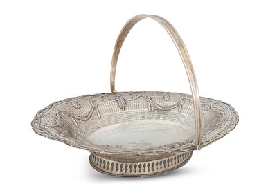 Lot 395 - A GEORGE III CAKE BASKET, Dublin 1780, in the...