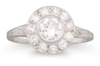 Lot 256 - A DIAMOND TARGET CLUSTER RING, set with...