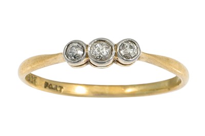 Lot 8 - A THREE STONE DIAMOND RING, mounted in gold....