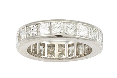 Lot 416 - A DIAMOND ETERNITY RING, the princess cut...
