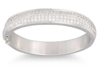 Lot 197 - A DIAMOND SET BANGLE, pavé set with brilliant...