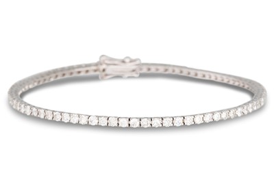 Lot 260 - A DIAMOND LINE BRACELET, the brilliant cut...