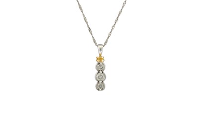 Lot 107 - A DIAMOND THREE STONE PENDANT, the graduated...