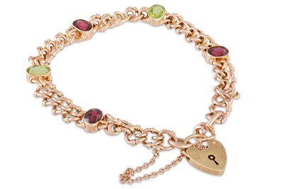 Lot 22 - A GARNET AND PERIDOT CURB BRACELET, in gold,...