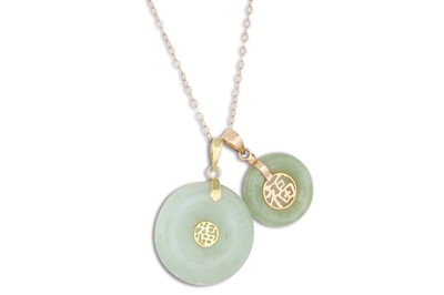 Lot 40 - TWO JADE PENDANTS, of circular form, oriental...