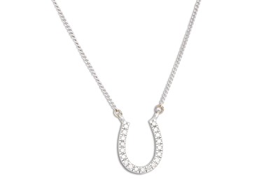 Lot 87 - A DIAMOND HORSE SHOE PENDANT, on a chain