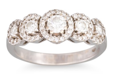 Lot 243 - A FIVE STONE DIAMOND RING, the graduated halo...