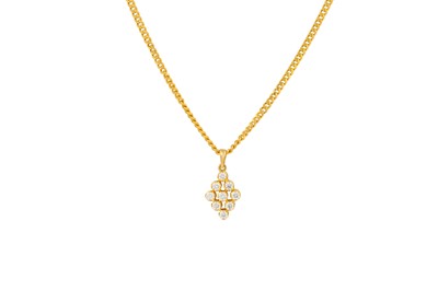 Lot 389 - A DIAMOND PENDANT, set with nine diamonds,...