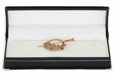 Lot 187 - AN ATTRACTIVE 9CT GOLD STONE SET TARA BROOCH,...