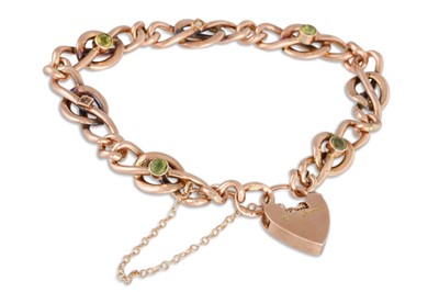 Lot 23 - A 9CT GOLD GEM SET CURB BRACELET, with padlock,...