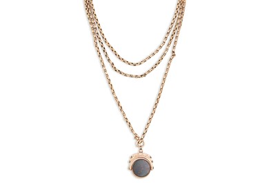 Lot 72 - A GOLD MUFF CHAIN, with swivel seal set with...