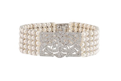 Lot 104 - A MODERN FIVE ROWED PEARL AND DIAMOND BRACELET,...