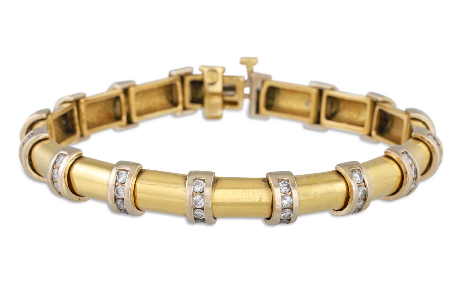 Lot 90 - A DIAMOND SET BRACELET, the 18ct gold solid...
