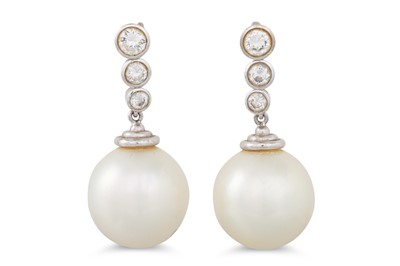 Lot 47 - A PAIR OF PEARL AND DIAMOND DROP EARRINGS, the...