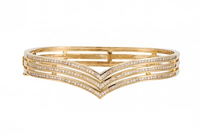 Lot 247 - A DIAMOND SET TRIPLE ROW HINGED BANGLE, of...