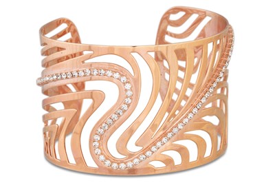 Lot 297 - A 9CT GOLD BANGLE, together with a modern...
