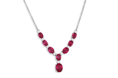Lot 129 - A RUBILITE AND DIAMOND PENDANT, mounted in...