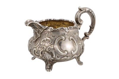 Lot 538 - A VICTORIAN SILVER MILK JUG OF ROCOCO FORM,...