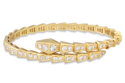 Lot 168 - A DIAMOND SET BANGLE, modelled as a snake,...