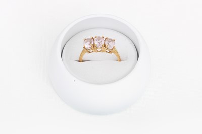 Lot 19 - A THREE STONE KUNZITE RING, mounted in 9ct...