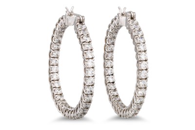 Lot 233 - A PAIR OF WHITE STONE SET HOOP EARRINGS, of...