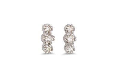 Lot 237 - A PAIR OF THREE STONE DIAMOND EARRINGS,...