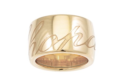 Lot 270 - A CHOPARD RING, the wide 18ct gold band...