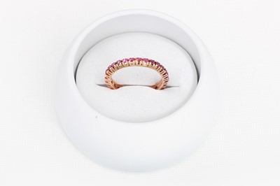 Lot 81 - A RUBY FULL ETERNITY RING, size L