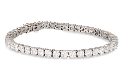 Lot 292 - A DIAMOND LINE BRACELET, the brilliant cut...