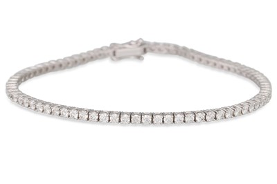 Lot 293 - A DIAMOND LINE BRACELET, the brilliant cut...