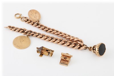 Lot 2 - A 9CT GOLD CHARM BRACELET, with charms...
