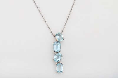 Lot 59 - AN AQUAMARINE PENDANT, various cut stones, in...
