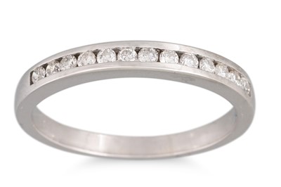 Lot 160 - A DIAMOND CHANNEL SET HALF ETERNITY RING,...