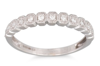 Lot 161 - A DIAMOND SET HALF HOOP DRESS RING, the round...