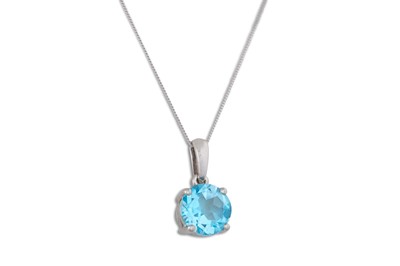 Lot 35 - A TOPAZ PENDANT, on a chain