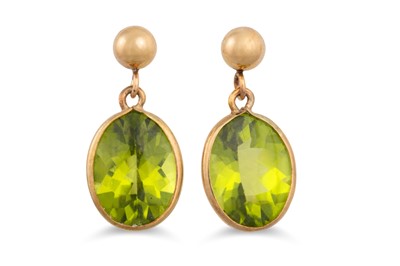 Lot 38 - A PAIR OF PERIDOT DROP EARRINGS, mounted in...