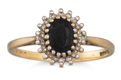 Lot 88 - A DIAMOND AND SAPPHIRE CLUSTER RING, mounted...