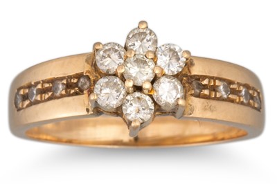 Lot 187 - A DIAMOND SEVEN STONE CLUSTER RING, mounted in...